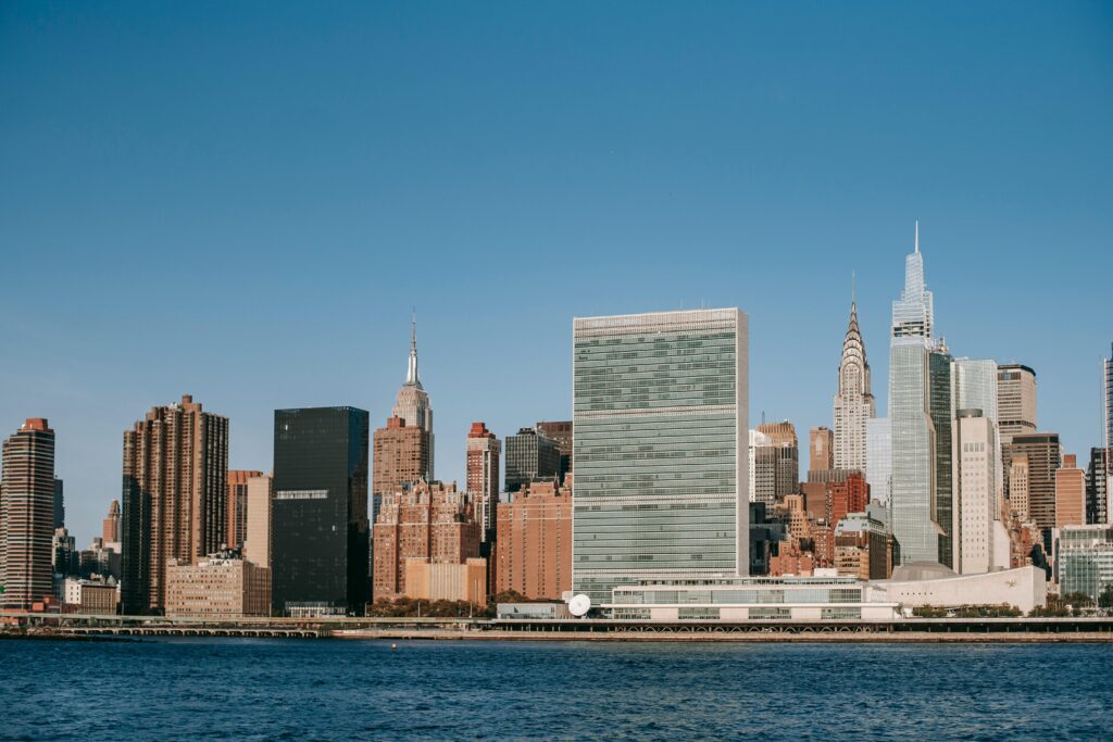 Stunning view of the New York City skyline featuring iconic skyscrapers under a clear blue sky.